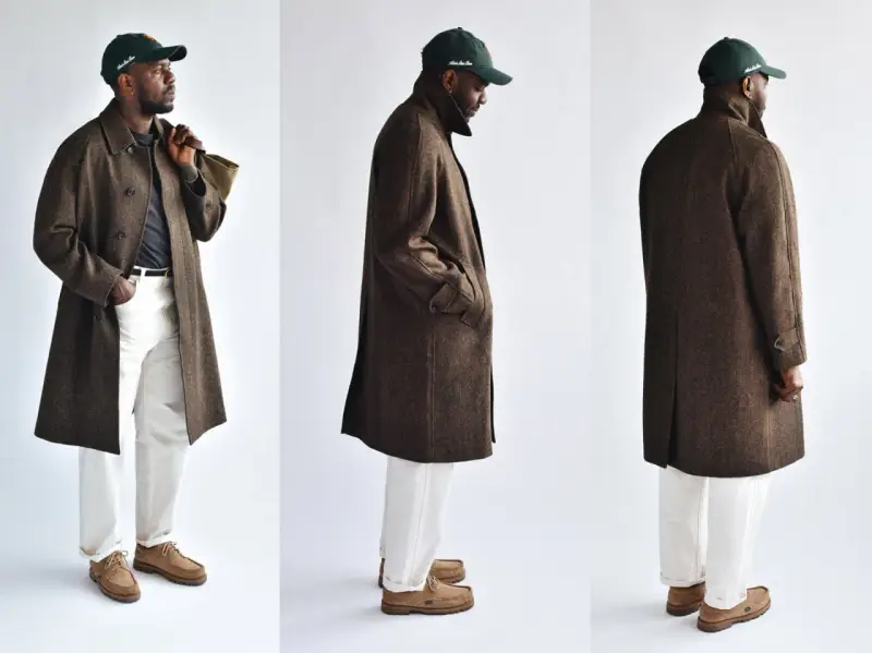 A man models three views of a stylish brown tweed coat, paired with white pants and a green cap.